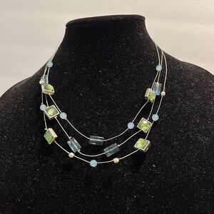 1️⃣ Silver toned and green necklace